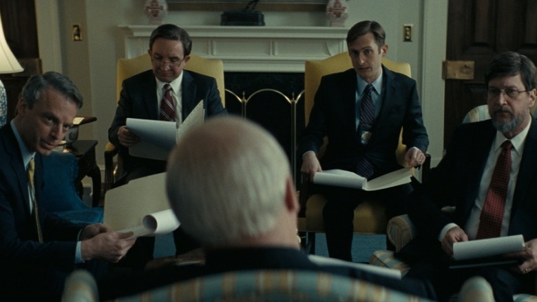 Justin Kirk, Eddie Marsan, Brandon Bales, and Don Macmanus as Scooter Libby, Paul Wolfowitz, CIA Agent, and David Addington respectively