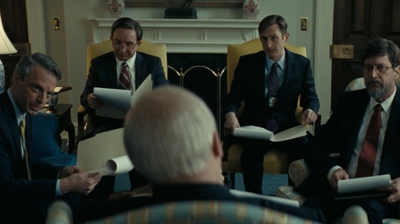 Justin Kirk, Eddie Marsan, Brandon Bales, and Don Macmanus as Scooter Libby, Paul Wolfowitz, CIA Agent, and David Addington respectively