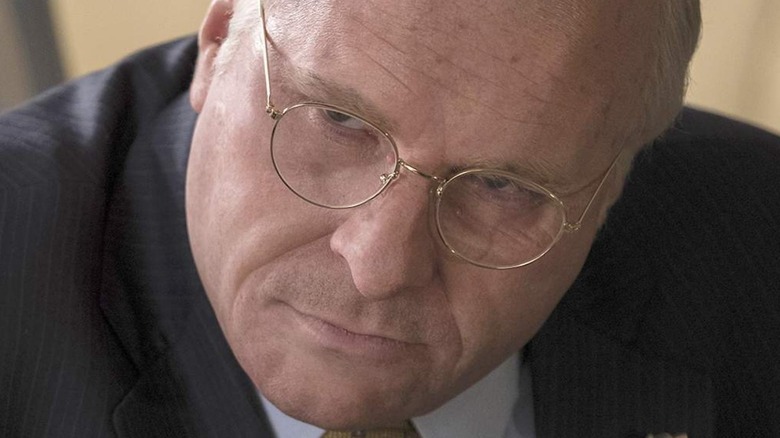 Christian Bale as Dick Cheney leaning forward