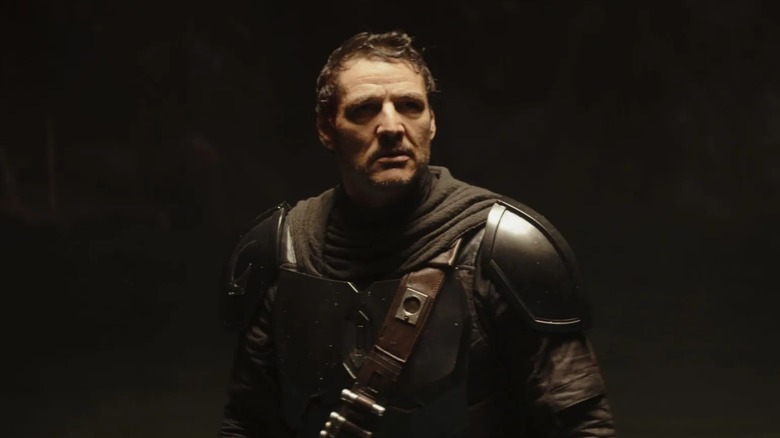 Din Djarin looking up at a monster without his trusty helmet in "The Mandalorian and Grogu" (2026)