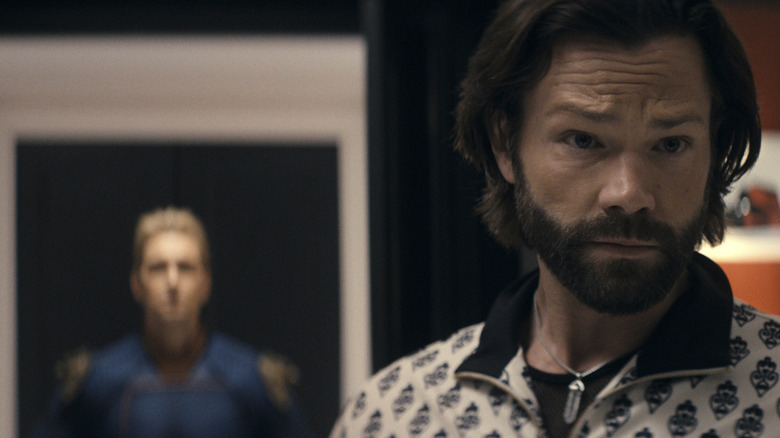 Mister Marathon stands before a portrait of Homelander in "The Boys"