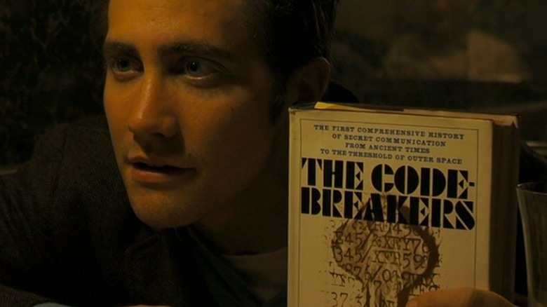 Graysmith holding a library book