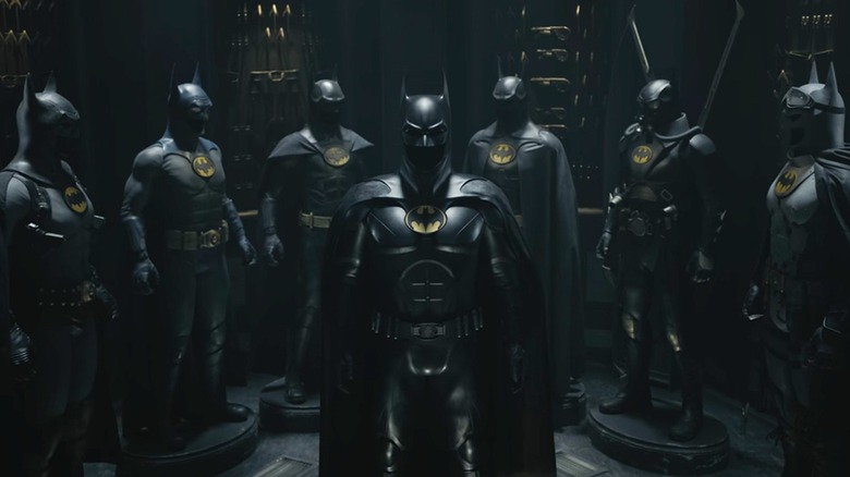 Several batsuits posed together in The Flash (2023)