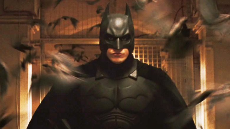 Batman surrounded by bats