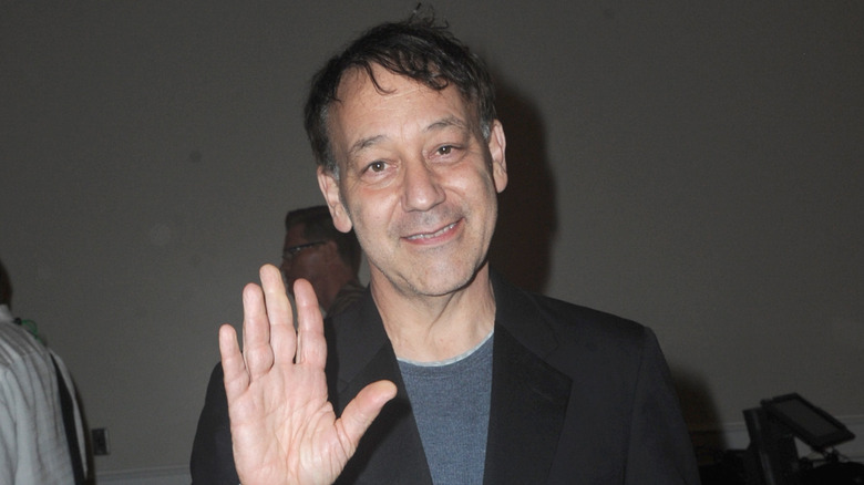 Sam Raimi waving and smiling