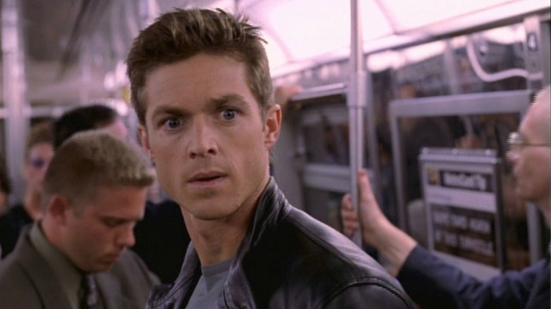 Michael Wiseman looking disoriented on a train in Now and Again (1999)