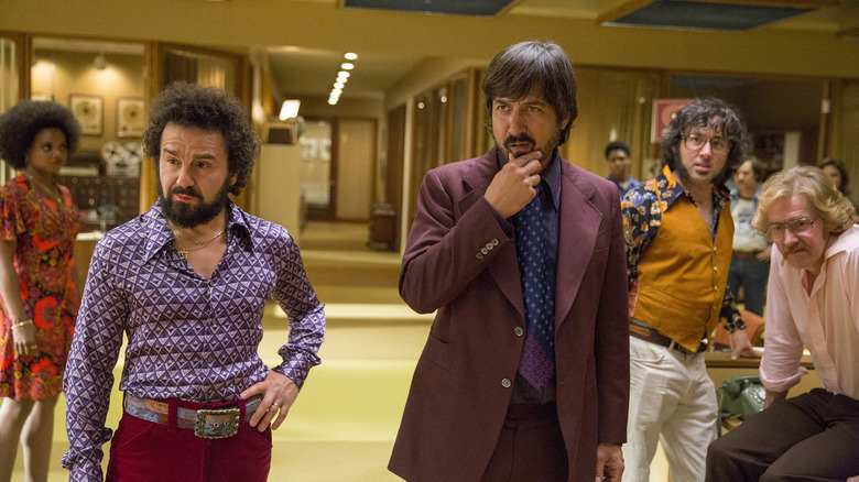 Zak Yankovich inspecting a client in Vinyl (2016)