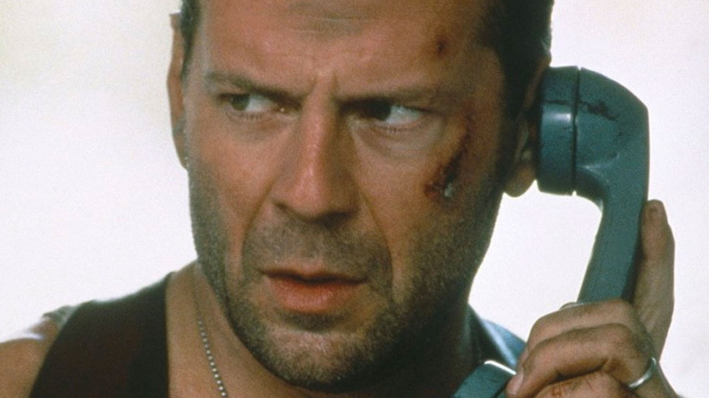 Bruce Willis answering a phone call