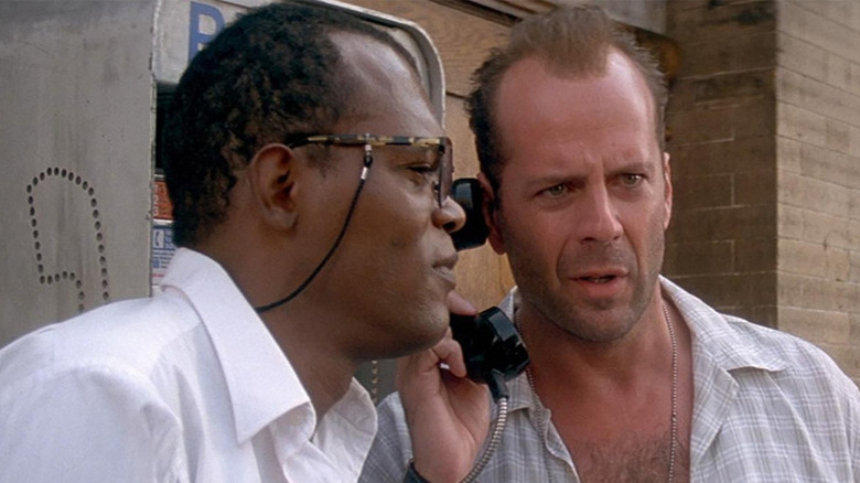 Bruce Willis answering a phone call with Samuel L. Jackson