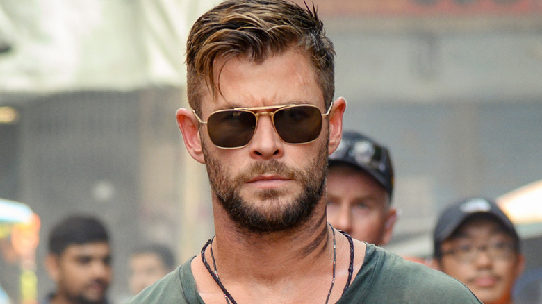 Chris Hemsworth wearing sunglasses in Extraction