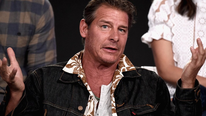 Ty Pennington with his arms outstretched 