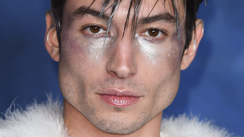 Ezra Miller wearing silver glitter