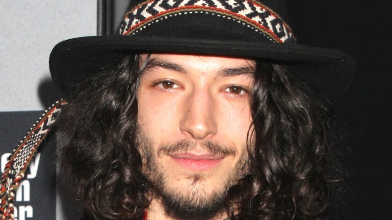 Ezra Miller in a hat