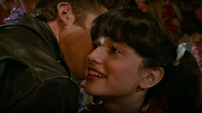 Michael whispers into Dolores's ear in "Grease 2" (1982)