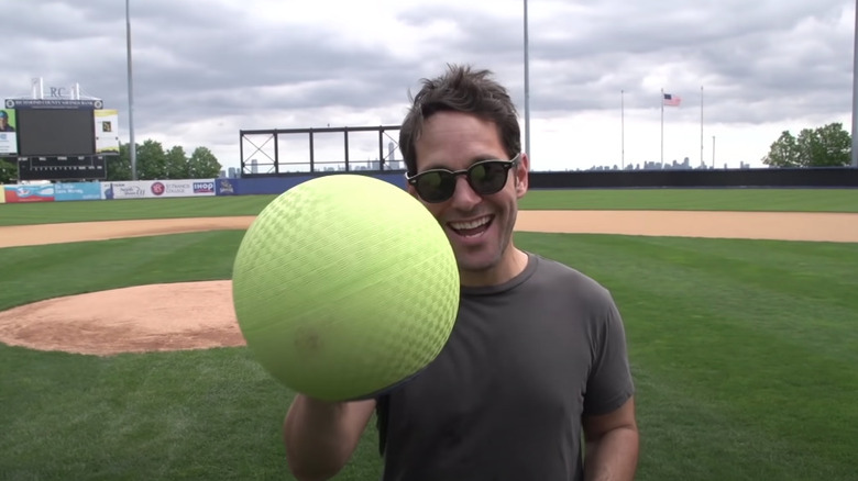 Paul Rudd holding a ball 