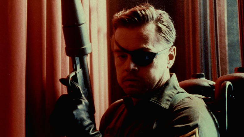 Rick Dalton holds flamethrower