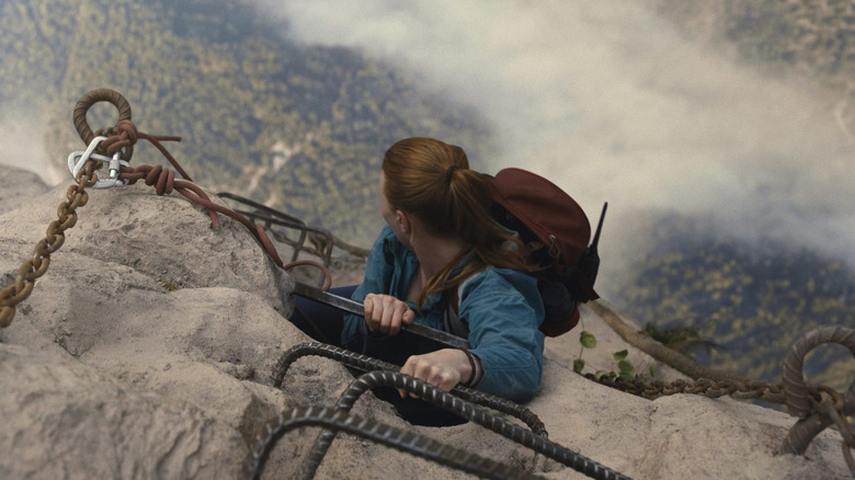 Jax climbing a ladder up a mountain in Fall 2: Deadpoint