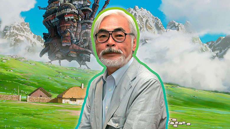 Hayao Miyazaki in front of Howl's Moving Castle