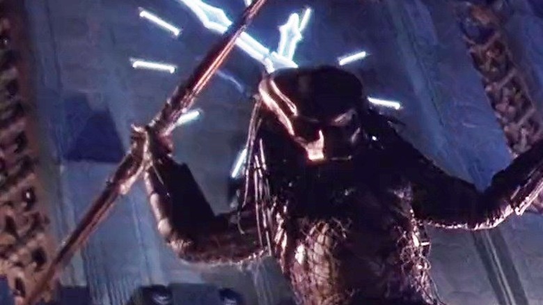 The city hunter standing in front of a tall building in Predator 2