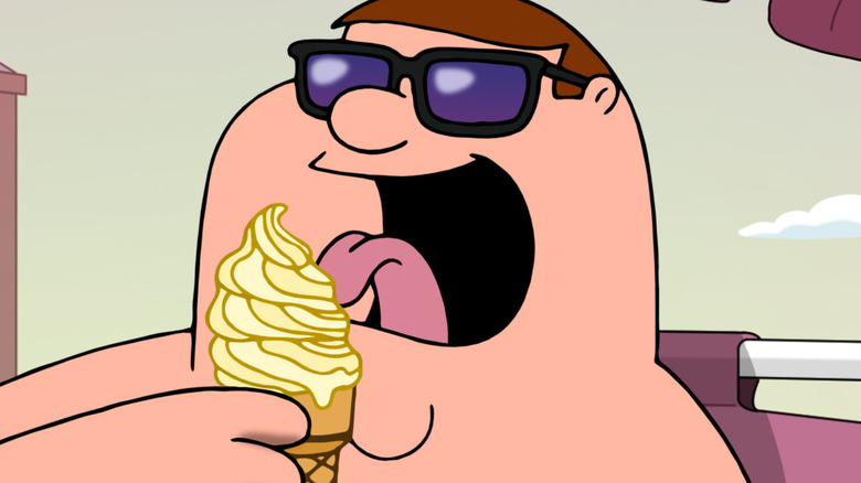 Peter eating ice cream on the beach