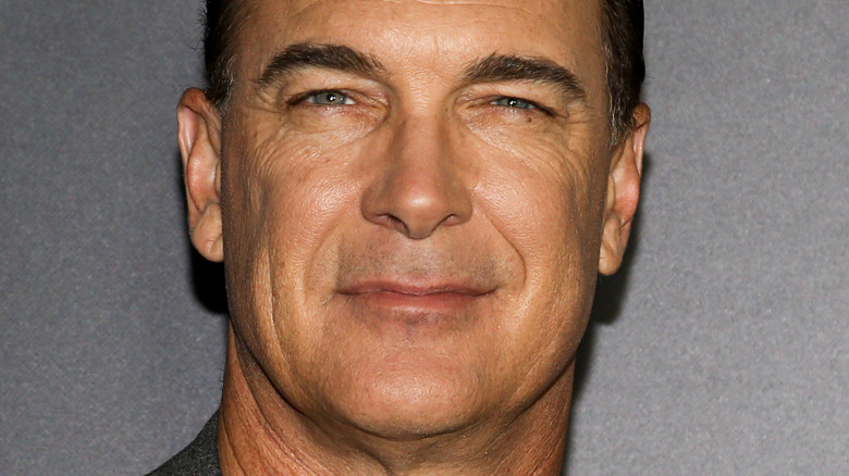 Patrick Warburton at event smiling