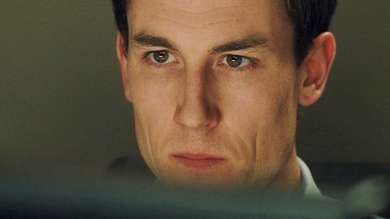 Villiers looking at computer