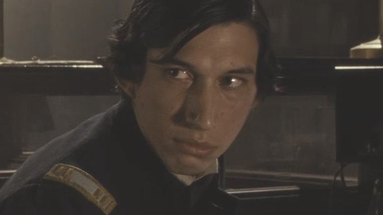 Adam Driver looks over shoulder