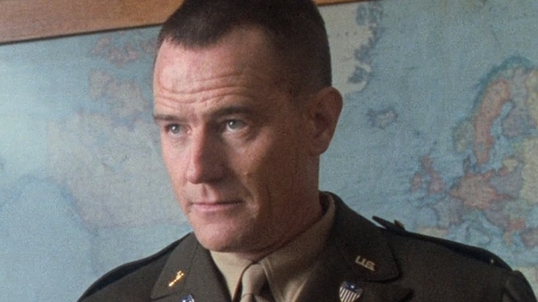 Bryan Cranston in front of map