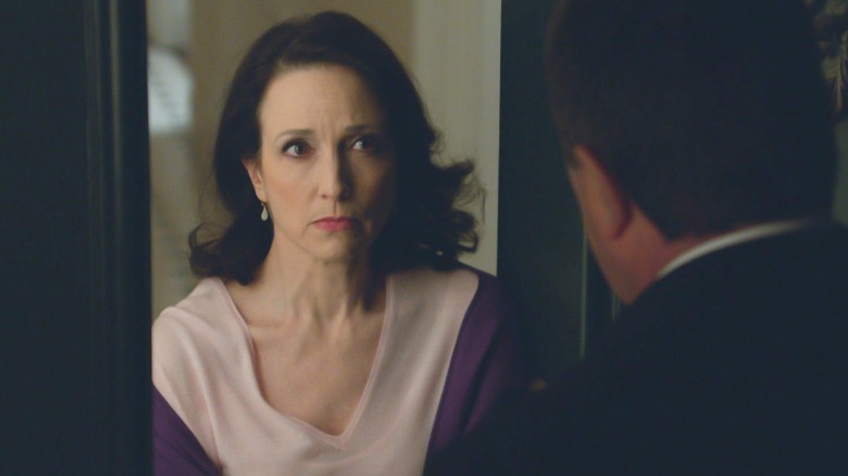 Bebe Neuwirth in door frame