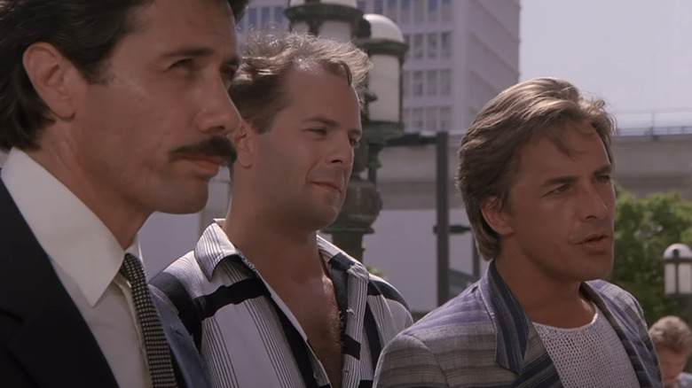 Don Johnson next to Bruce Willis