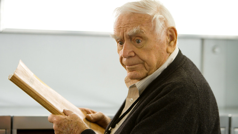 Henry clutches a file