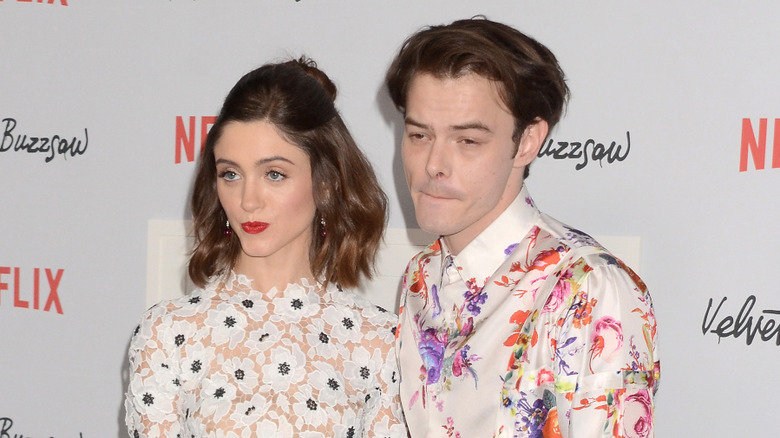 Natalia Dyer and Charlie Heaton pose together