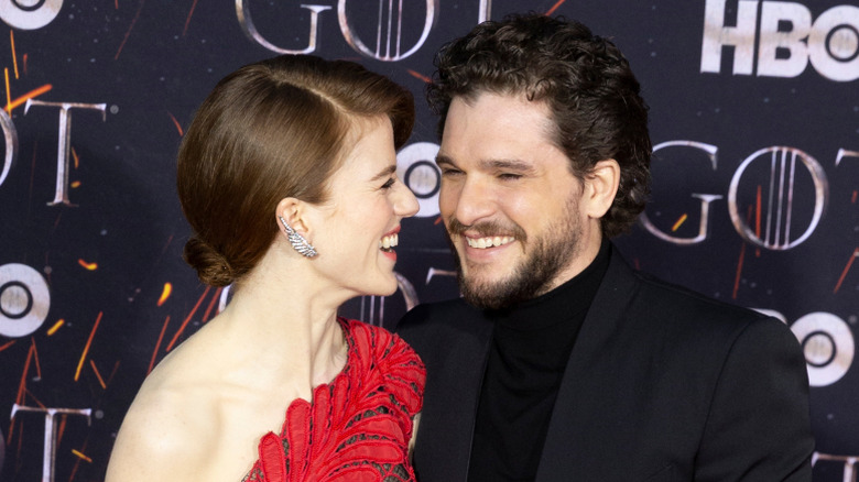 Kit Harington and Rose Leslie standing closing at Game of Thrones event