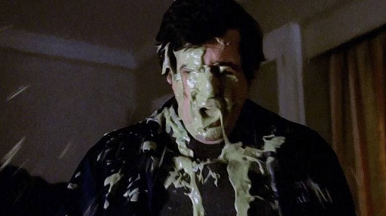 Father Karras covered in vomit