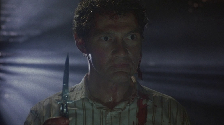 Frank holds up switchblade