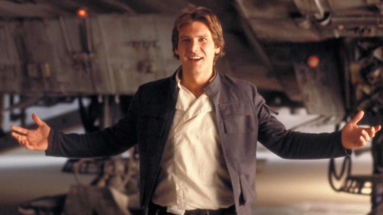 Han Solo with arms in air looking happy