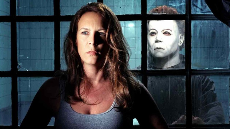 Michael Meyers standing behind Laurie Strode in Halloween