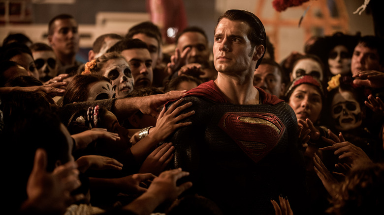 Superman surrounded by people