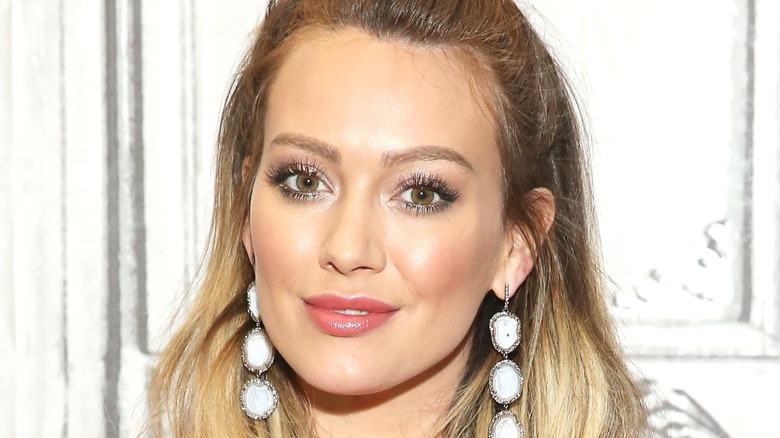 Hilary Duff with white dangling earrings