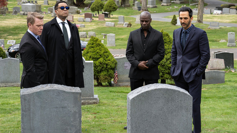 Ressler, Cooper, Dembe, and Aram mourning Liz