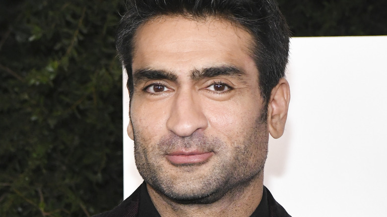 Kumail Nanjiani smirking