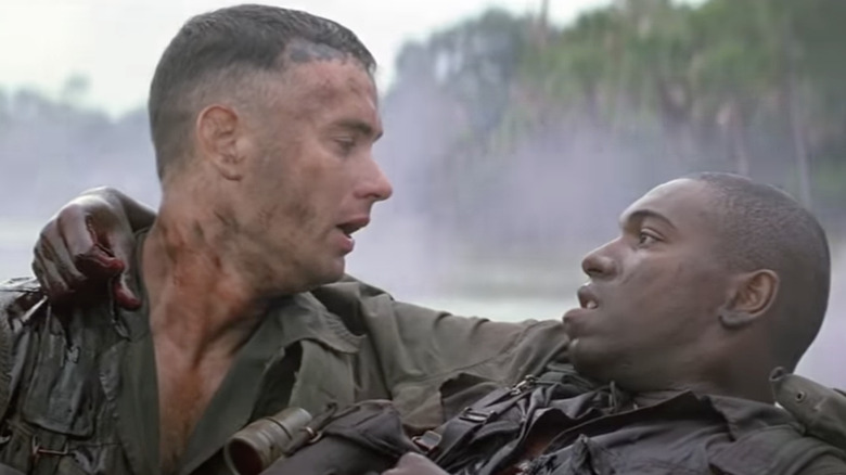 Forrest holding a dying Bubba