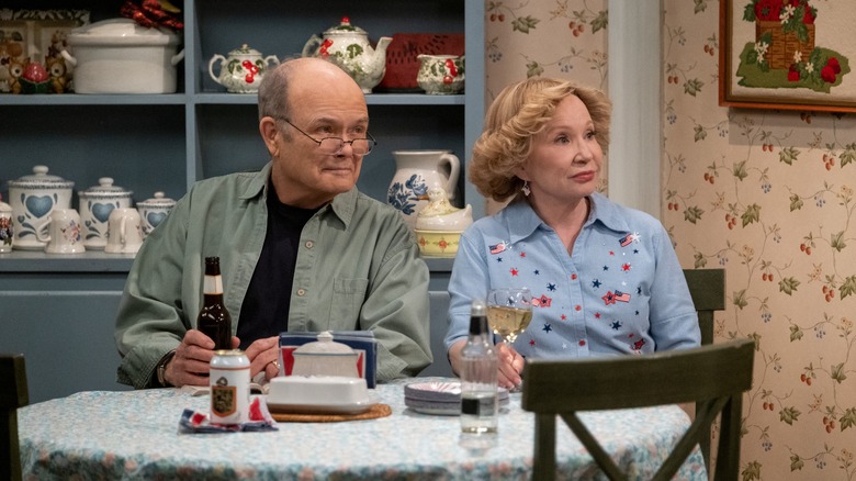 Red and Kitty Forman sitting in kitchen
