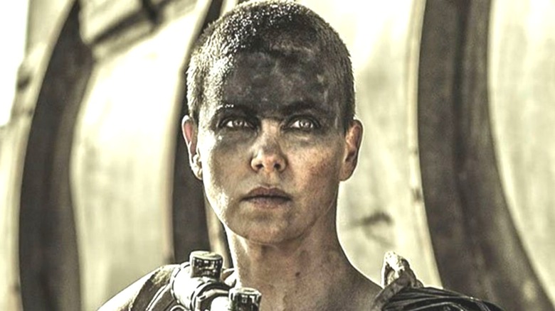 Furiosa standing by her war rig 