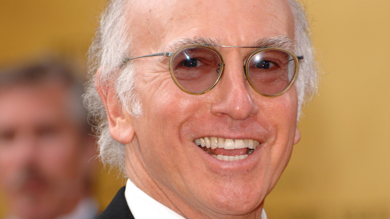 Larry David smiling for press photo