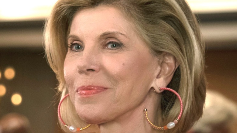 Christine Baranski smiling with giant earrings