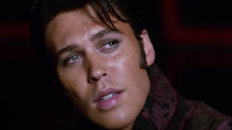 Austin Butler's Elvis looks left