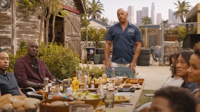 Dom at head of dinner table