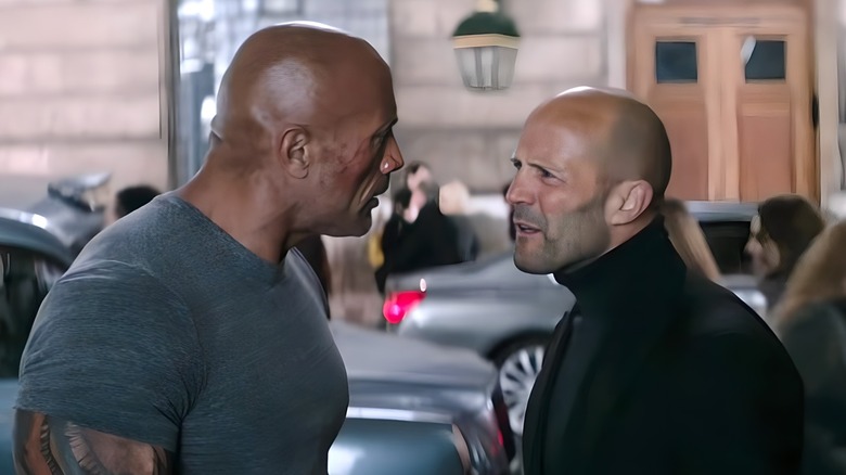 Luke Hobbs and Deckard Shaw look at each other menacingly