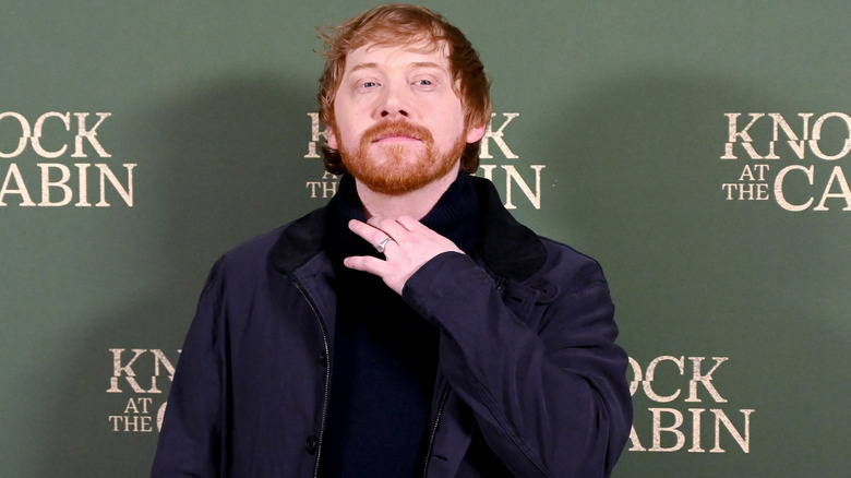 Rupert Grint smiling at premiere
